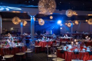 Elegant ballroom reception setup with chandeliers and lighting at Oasis Convention Centre