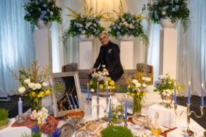 Persian Nowruz celebration Haft-Seen table and floral stage setup at Oasis Convention Centre