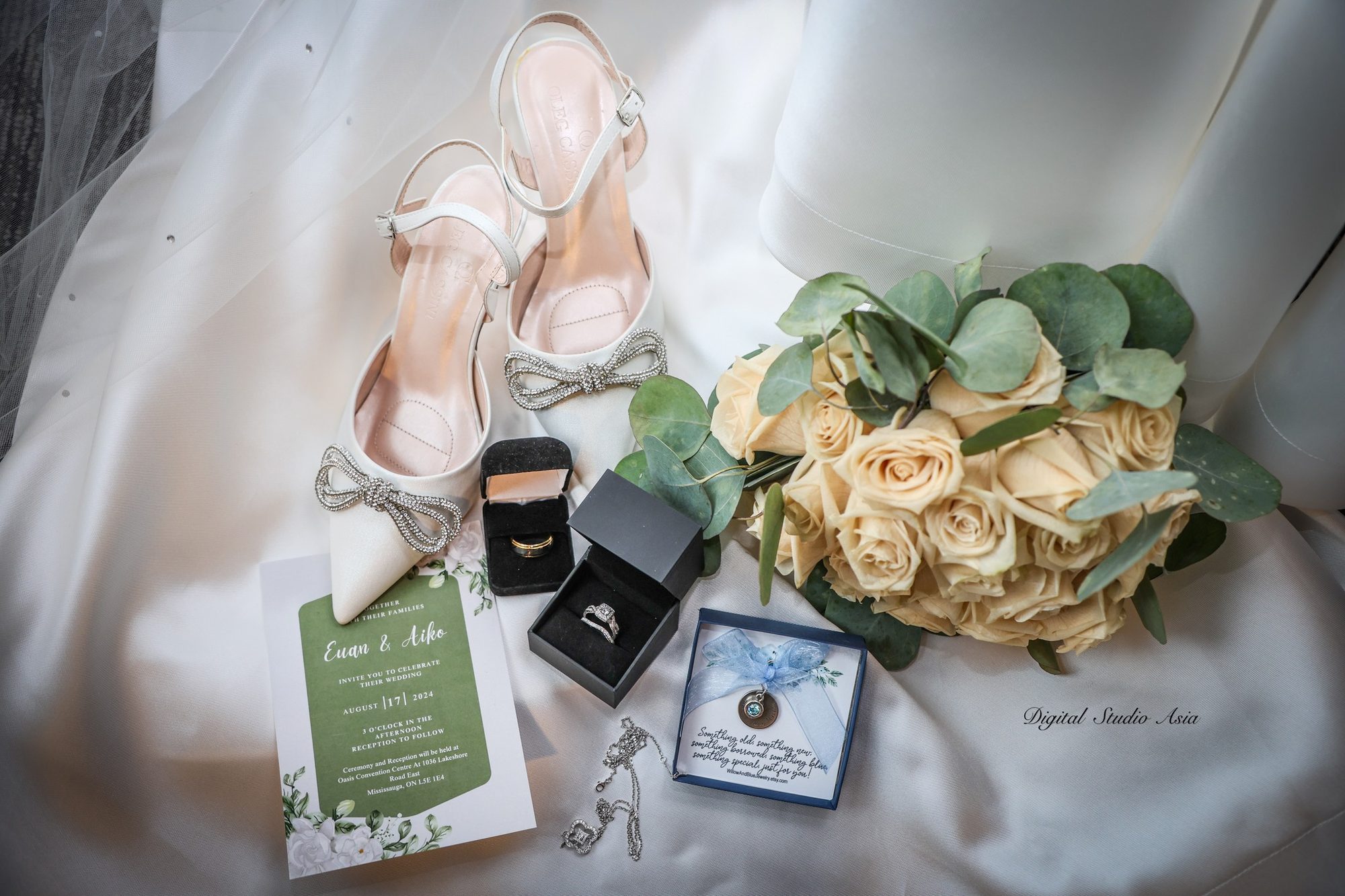 Wedding detail flatlay with rings and florals