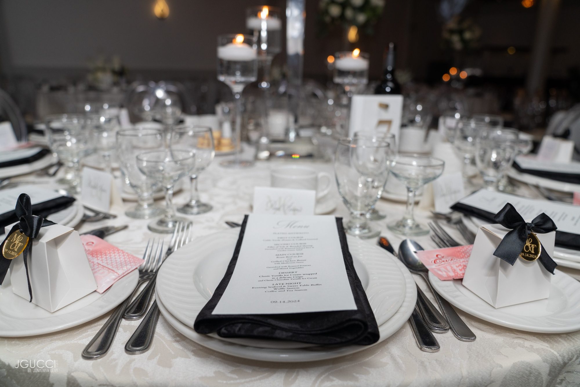 Elegant wedding place settings with menu and florals